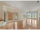 This living room has hardwood floors and lots of windows offering beautiful views at 11065 Spice Ln, Fishers, IN 46037