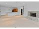 Spacious living room features stone fireplace, built-in shelving, and a convenient wet bar for entertaining at 11065 Spice Ln, Fishers, IN 46037