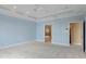 Spacious carpeted main bedroom features tray ceiling and ensuite bathroom entry at 11065 Spice Ln, Fishers, IN 46037