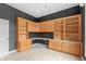 This home office has plenty of storage with built-in cabinets and lots of shelving at 11065 Spice Ln, Fishers, IN 46037