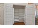 Walk-in pantry with shelving and door storage maximizes kitchen organization at 11065 Spice Ln, Fishers, IN 46037