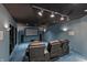 Cozy theater room features comfortable seating, a large screen, and atmospheric lighting at 11065 Spice Ln, Fishers, IN 46037