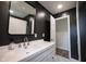 Chic bathroom featuring dark gray walls, white marble floors, and a modern vanity at 11423 Atlantic Rd, Fortville, IN 46040