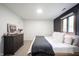 Bright bedroom with hardwood floors, natural light, and grey dresser at 11423 Atlantic Rd, Fortville, IN 46040