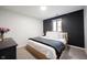 Comfortable bedroom with contrasting walls and a large window, creating a relaxing atmosphere at 11423 Atlantic Rd, Fortville, IN 46040
