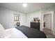 Bright bedroom featuring light-colored walls, a large dresser, and a walk-in closet for ample storage at 11423 Atlantic Rd, Fortville, IN 46040