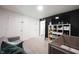 Spacious carpeted bedroom with a crib, sofa, and organized shelving unit at 11423 Atlantic Rd, Fortville, IN 46040