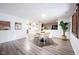 Bright dining area with hardwood floors, modern decor, and an open layout connected to the kitchen at 11423 Atlantic Rd, Fortville, IN 46040