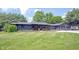Beautiful single-story home with a well-manicured lawn and an inviting porch at 11423 Atlantic Rd, Fortville, IN 46040