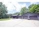 Ranch home with a three-car garage and a long driveway to the front entrance at 11423 Atlantic Rd, Fortville, IN 46040