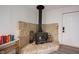 Rustic stone fireplace creates a cozy and inviting focal point, complete with wood storage and charming details for warmth and ambiance at 11423 Atlantic Rd, Fortville, IN 46040