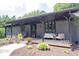 Inviting covered porch with ample seating, decorative plants, and a welcoming entrance at 11423 Atlantic Rd, Fortville, IN 46040