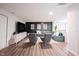 Stylish living room features a modern entertainment center, plush seating, and a welcoming atmosphere, perfect for relaxation and gatherings at 11423 Atlantic Rd, Fortville, IN 46040