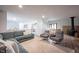 Bright living room with open floor plan, cozy seating, stone fireplace, and modern accents, offering a welcoming and stylish atmosphere at 11423 Atlantic Rd, Fortville, IN 46040