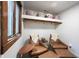Sitting area with shelving, two leather chairs and an ottoman, plus accent table and window at 11423 Atlantic Rd, Fortville, IN 46040