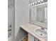 Bathroom featuring a vanity with marble countertop, sink, and a shower with updated fixtures at 11753 Pawleys Ct, Indianapolis, IN 46235