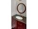 Elegant bathroom vanity with a unique mirror and modern fixtures at 11753 Pawleys Ct, Indianapolis, IN 46235