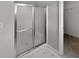 Bathroom with a glass-enclosed shower with tiled walls at 11753 Pawleys Ct, Indianapolis, IN 46235