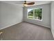 Bedroom with a ceiling fan, neutral carpet and a large window providing ample natural light at 11753 Pawleys Ct, Indianapolis, IN 46235