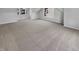 Bright bedroom with neutral carpet, white walls, and natural light from two windows at 11753 Pawleys Ct, Indianapolis, IN 46235