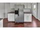 Spacious kitchen showcasing stainless steel refrigerator and plenty of cabinet space at 11753 Pawleys Ct, Indianapolis, IN 46235
