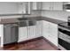 Well-equipped kitchen featuring a stainless steel sink and modern appliances at 11753 Pawleys Ct, Indianapolis, IN 46235