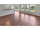 Open concept living room boasts lots of natural light and hardwood floors at 11753 Pawleys Ct, Indianapolis, IN 46235