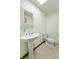 Powder room features green walls, pedestal sink and toilet at 11875 W 700 S, Columbus, IN 47201