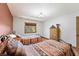 Cozy bedroom with two beds, a wooden armoire and window allowing natural light into the space at 11875 W 700 S, Columbus, IN 47201