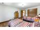 Comfortable bedroom with two beds and closet at 11875 W 700 S, Columbus, IN 47201
