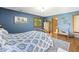 Comfortable bedroom with natural light, offering a pleasant space with hardwood floors, a window and a closet at 11875 W 700 S, Columbus, IN 47201