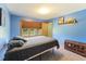 Serene bedroom with lake view, featuring large windows and a charming antique trunk for extra storage at 11875 W 700 S, Columbus, IN 47201