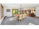Dining room features a wooden table with seating for six, seamlessly connecting to the kitchen area at 11875 W 700 S, Columbus, IN 47201
