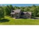 Well-maintained home with verdant lawn and manicured landscaping at 11875 W 700 S, Columbus, IN 47201