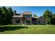 Inviting two-story home featuring a stone chimney and a well-manicured lawn at 11875 W 700 S, Columbus, IN 47201