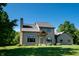 Charming two-story home with stone chimney, inviting entrance and manicured lawn at 11875 W 700 S, Columbus, IN 47201
