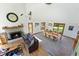 Open floor plan features a stone fireplace, large windows and access to the dining room at 11875 W 700 S, Columbus, IN 47201