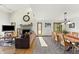 Inviting living room features a stone fireplace, views, and flows into a dining area for seamless entertaining and Gathering gatherings at 11875 W 700 S, Columbus, IN 47201