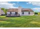 Well-kept lawn and cozy patio provides a pleasant outdoor retreat for relaxation and recreation at 12250 Longstraw Dr, Indianapolis, IN 46236