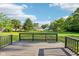 Spacious backyard with a wood deck and lush lawn perfect for outdoor entertaining and relaxation at 12250 Longstraw Dr, Indianapolis, IN 46236