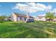 This home features a well-maintained lawn and a charming outdoor deck, ideal for relaxation and entertaining at 12250 Longstraw Dr, Indianapolis, IN 46236