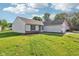 Charming home with a well-maintained lawn, showcasing its delightful curb appeal at 12250 Longstraw Dr, Indianapolis, IN 46236