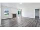 Bright living room featuring a fireplace, sliding glass doors to deck, and modern flooring at 12250 Longstraw Dr, Indianapolis, IN 46236