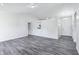 Spacious living area with modern floors, bright walls, and natural light at 12250 Longstraw Dr, Indianapolis, IN 46236