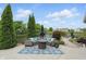 Inviting backyard patio with outdoor seating area, fire pit, and view of the lake at 1281 Jesse Ct, Greenwood, IN 46143
