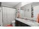 Bathroom showcasing dual sinks, granite countertop, decorative shelves, and modern fixtures at 1281 Jesse Ct, Greenwood, IN 46143