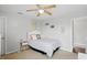 Cozy bedroom boasts a ceiling fan, a side table, and minimalist decor at 1281 Jesse Ct, Greenwood, IN 46143