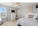 Charming bedroom with art prints, floating shelves, a side table, and a ceiling fan at 1281 Jesse Ct, Greenwood, IN 46143