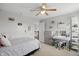 Bright bedroom with a ceiling fan, decorated vanity, and a comfortable bed at 1281 Jesse Ct, Greenwood, IN 46143