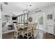 Bright dining area connected to living space features a decorative table with views through sliding doors at 1281 Jesse Ct, Greenwood, IN 46143